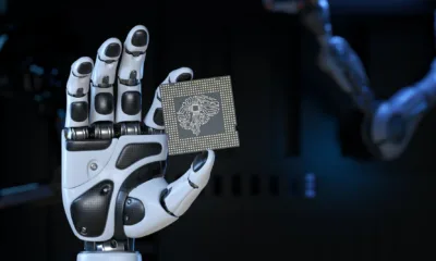 robot s hand holding an artificial intelligence computer processor unit jpg