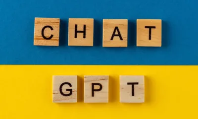 chatgpt background words in wooden letters chat with ai or artificial intelligence by openai  jpg